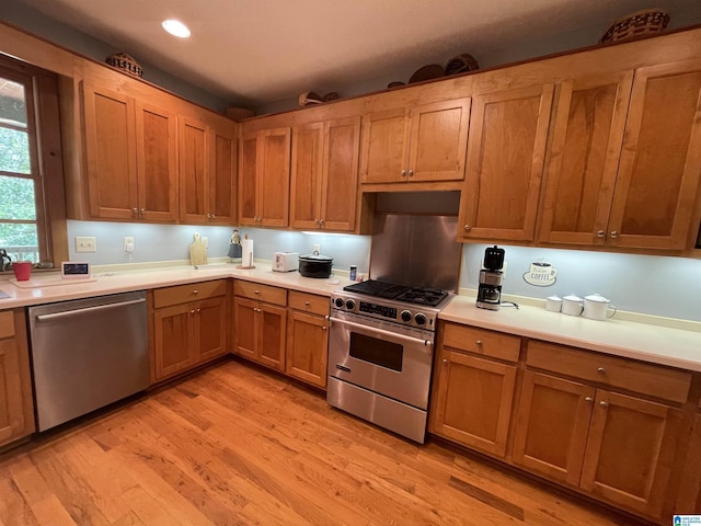 720 Good Hope Delta Rd, Delta, AL 36258 - kitchen featuring stainless steel appliances, light wood-type flooring, light countertops, brown cabinets, and recessed lighting