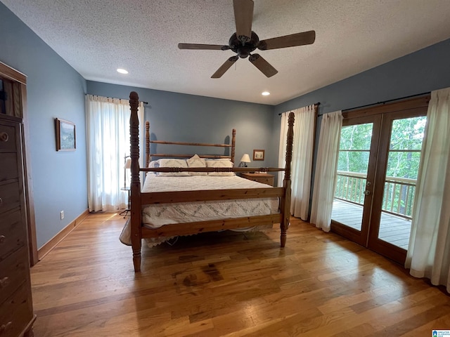 720 Good Hope Delta Rd, Delta, AL 36258 - bedroom featuring access to exterior, a textured ceiling, multiple windows, light wood-type flooring, and ceiling fan