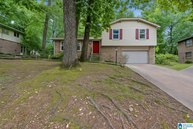 635 16th Ter NW, Center Point, AL 35215 - tri-level home with brick siding, a garage, and driveway