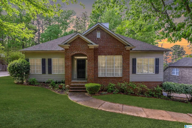 2246 Clairmont Dr, Leeds, AL 35094 - view of front of property featuring a lawn, brick siding, and a shingled roof