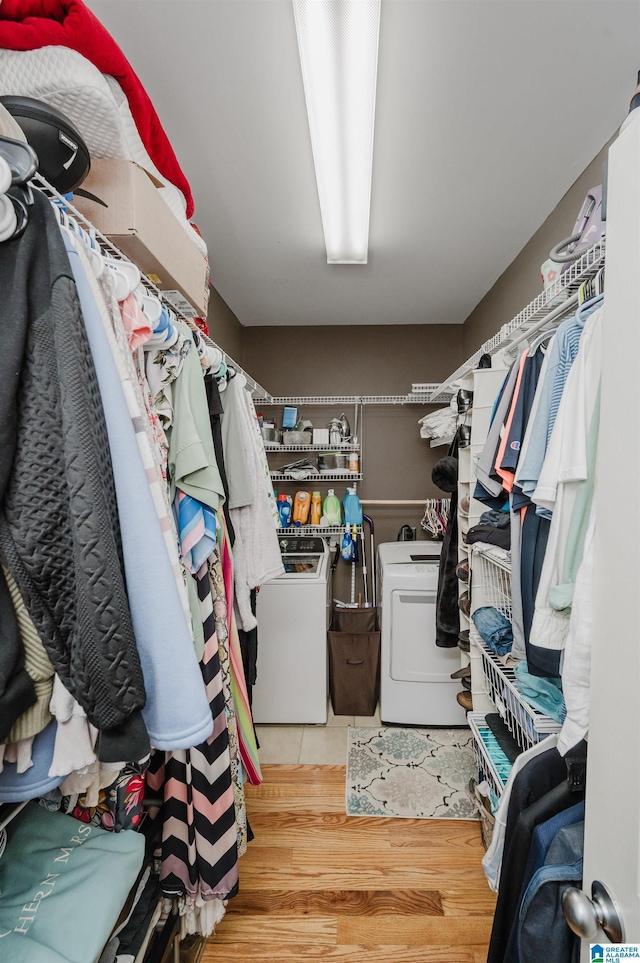 2246 Clairmont Dr, Leeds, AL 35094 - walk in closet featuring washer and clothes dryer and wood finished floors