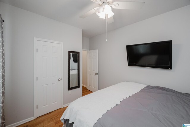 2246 Clairmont Dr, Leeds, AL 35094 - bedroom with wood finished floors and a ceiling fan