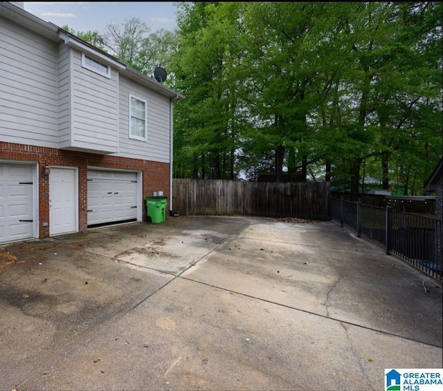 2246 Clairmont Dr, Leeds, AL 35094 - garage featuring driveway