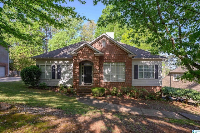 2246 Clairmont Dr, Leeds, AL 35094 - view of front of home featuring brick siding, a chimney, and a front lawn