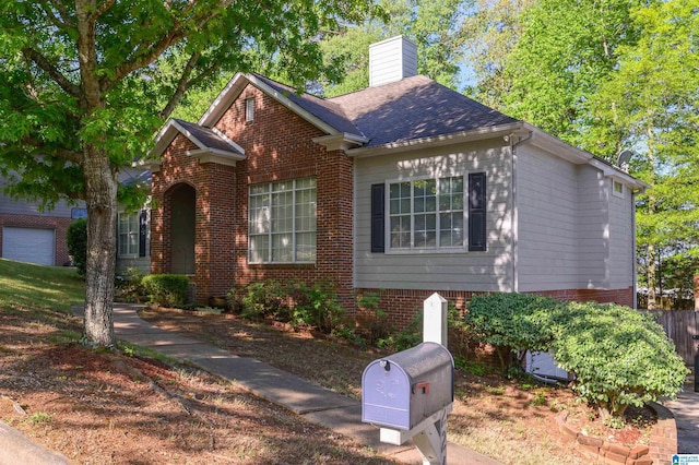 2246 Clairmont Dr, Leeds, AL 35094 - view of front of home featuring a chimney and brick siding