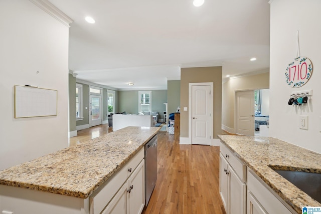 1710 Cullom St S, Birmingham, AL 35205 - kitchen with ornamental molding, white cabinets, open floor plan, light stone countertops, and recessed lighting