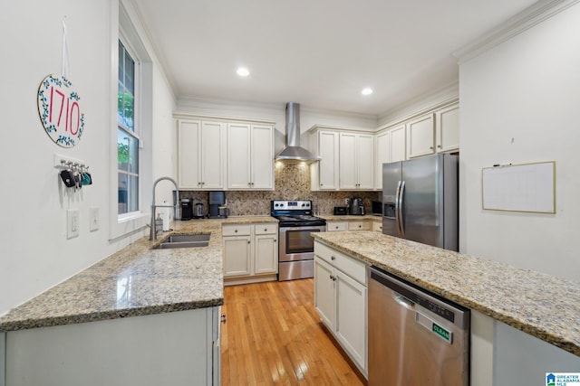 1710 Cullom St S, Birmingham, AL 35205 - kitchen featuring stainless steel appliances, wall chimney exhaust hood, a sink, backsplash, and crown molding