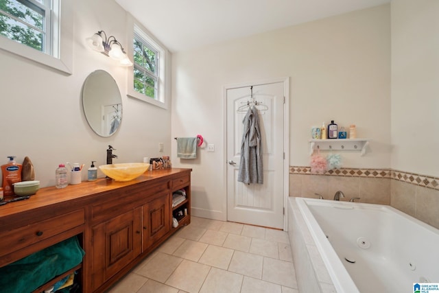 1710 Cullom St S, Birmingham, AL 35205 - full bath featuring a jetted tub, tile patterned floors, vanity, and baseboards