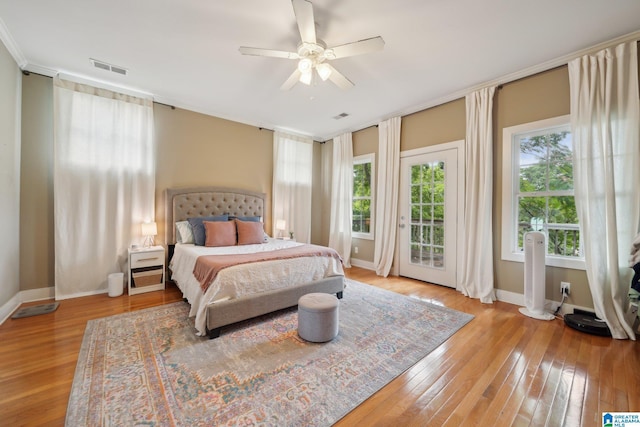 1710 Cullom St S, Birmingham, AL 35205 - bedroom with multiple windows, access to exterior, light wood-type flooring, and baseboards