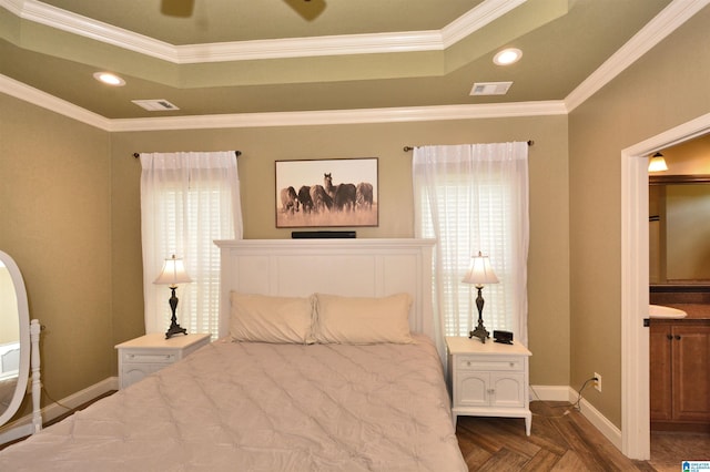 100 Weeping Cir, Wilsonville, AL 35186 - bedroom featuring a tray ceiling, crown molding, baseboards, recessed lighting, and ensuite bath