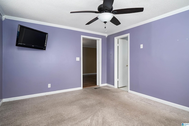 220 Honeysuckle Ln, Gardendale, AL 35071 - carpeted empty room featuring a ceiling fan, a textured ceiling, ornamental molding, and baseboards