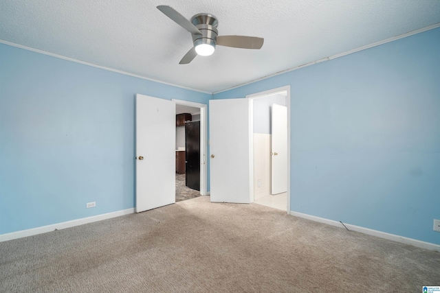 220 Honeysuckle Ln, Gardendale, AL 35071 - unfurnished bedroom featuring carpet floors, ornamental molding, a textured ceiling, ceiling fan, and baseboards