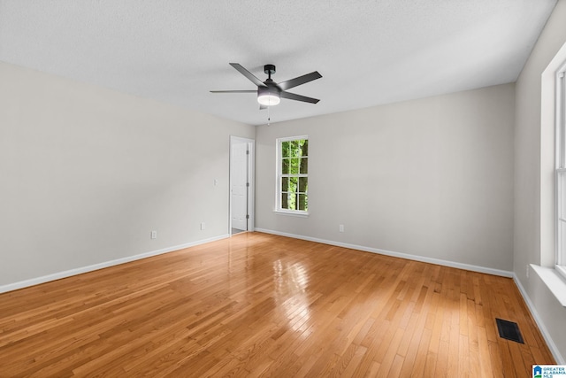 6415 Mays Bend Rd, Pell City, AL 35128 - unfurnished room featuring light wood-style floors, ceiling fan, and baseboards