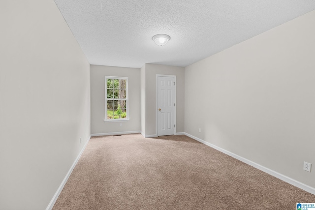 6415 Mays Bend Rd, Pell City, AL 35128 - unfurnished room featuring carpet floors, baseboards, and a textured ceiling