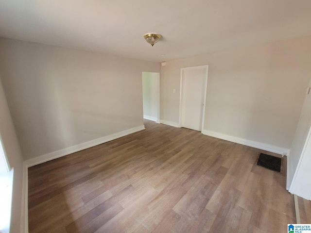 2308 Mayfield Ave, Birmingham, AL 35211 - unfurnished room with wood finished floors and baseboards