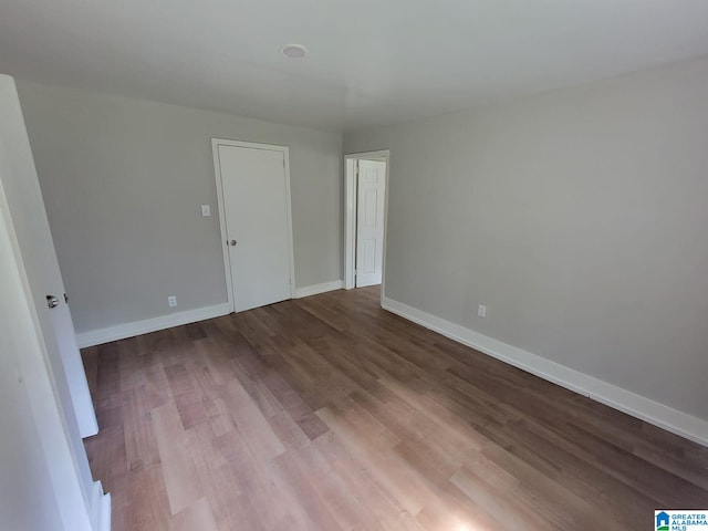 2308 Mayfield Ave, Birmingham, AL 35211 - spare room featuring wood finished floors and baseboards