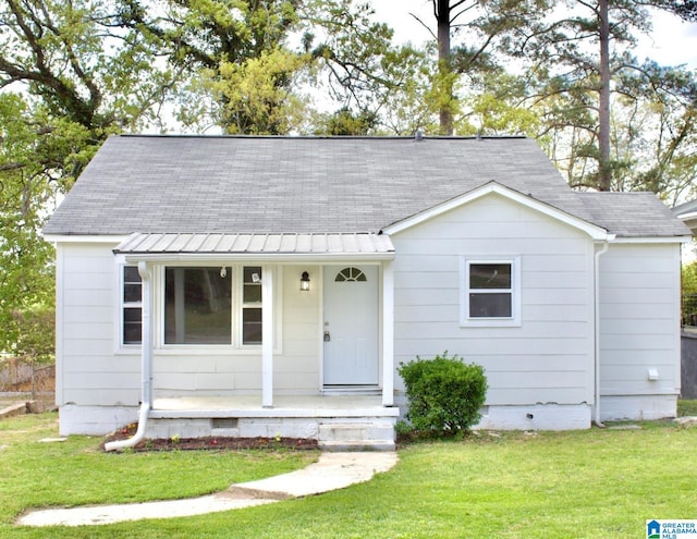 2912 Moore Ave, Anniston, AL 36201 - view of front of property with covered porch, crawl space, a front lawn, and a shingled roof