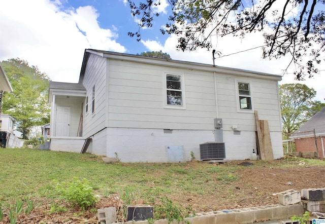 2912 Moore Ave, Anniston, AL 36201 - rear view of house with crawl space, cooling unit, and a yard