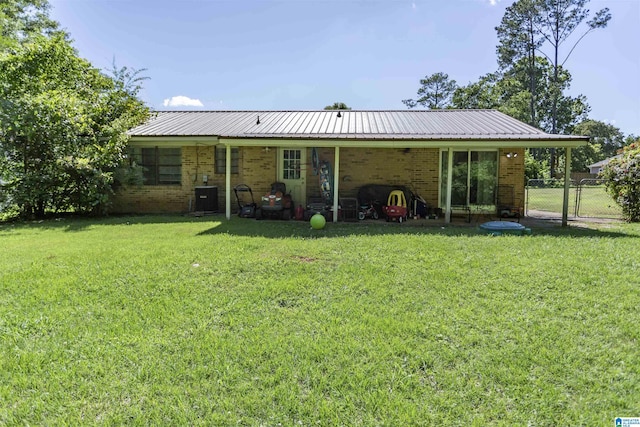 209 Meadowgreen Dr, Montevallo, AL 35115 - back of property featuring brick siding, central AC, and metal roof