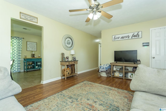 209 Meadowgreen Dr, Montevallo, AL 35115 - living area with wood finished floors, ceiling fan, and baseboards