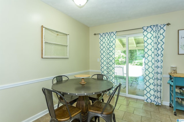 209 Meadowgreen Dr, Montevallo, AL 35115 - dining area with baseboards and light tile patterned flooring