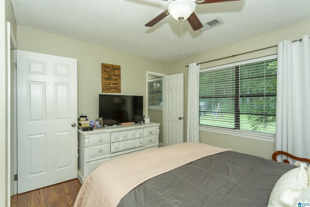 209 Meadowgreen Dr, Montevallo, AL 35115 - bedroom featuring dark wood finished floors and a ceiling fan