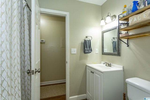 209 Meadowgreen Dr, Montevallo, AL 35115 - bathroom featuring vanity, toilet, wood finished floors, baseboards, and curtained shower