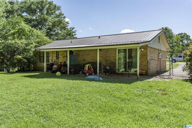 209 Meadowgreen Dr, Montevallo, AL 35115 - rear view of house with brick siding and metal roof
