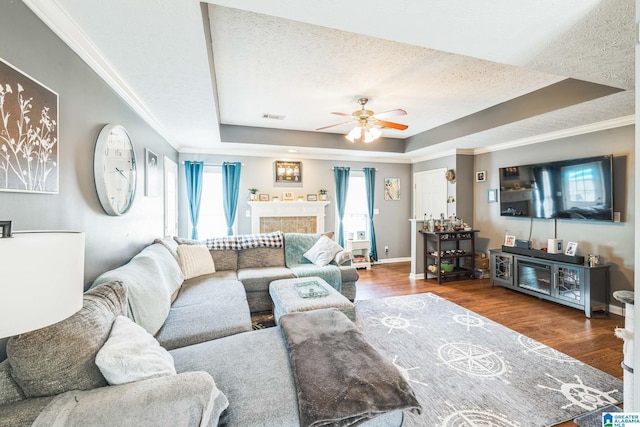 736 Buena Vista Loop, Prattville, AL 36067 - living area featuring a tray ceiling, healthy amount of natural light, ceiling fan, a textured ceiling, and ornamental molding