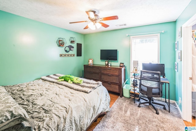 736 Buena Vista Loop, Prattville, AL 36067 - bedroom featuring wood finished floors, ceiling fan, a desk, and a textured ceiling