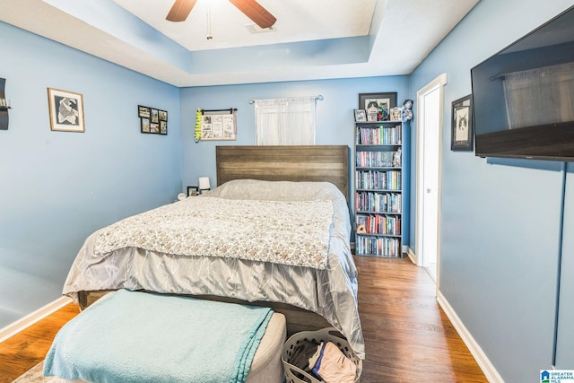 736 Buena Vista Loop, Prattville, AL 36067 - bedroom with wood finished floors, a raised ceiling, baseboards, and a ceiling fan