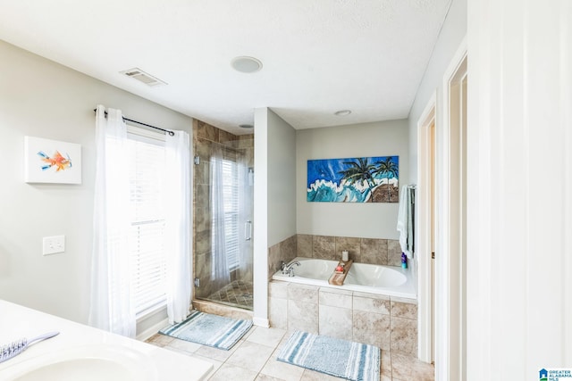 736 Buena Vista Loop, Prattville, AL 36067 - full bathroom with a garden tub, a shower stall, tile patterned floors, and vanity