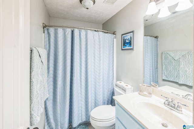 736 Buena Vista Loop, Prattville, AL 36067 - full bath featuring toilet, vanity, a textured ceiling, and a shower with curtain