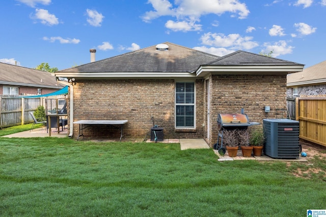 736 Buena Vista Loop, Prattville, AL 36067 - rear view of property featuring central AC, a patio, brick siding, and roof with shingles