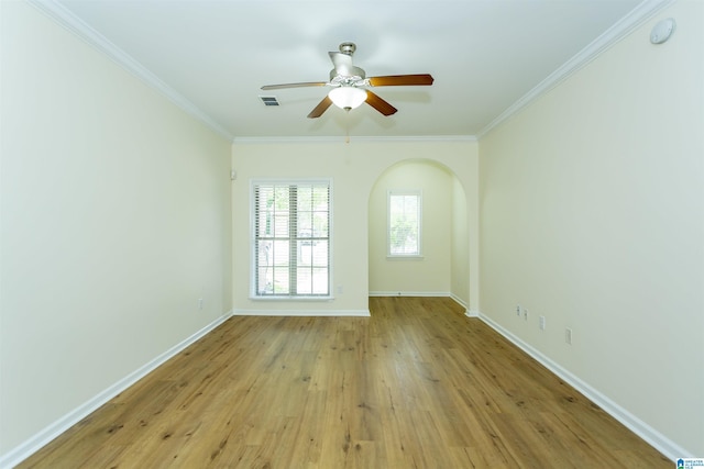 2449 Ridgemont Dr, Birmingham, AL 35244 - unfurnished room with a ceiling fan, crown molding, light wood finished floors, baseboards, and arched walkways