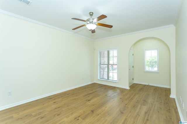 2449 Ridgemont Dr, Birmingham, AL 35244 - unfurnished room featuring ornamental molding, arched walkways, a ceiling fan, light wood finished floors, and baseboards