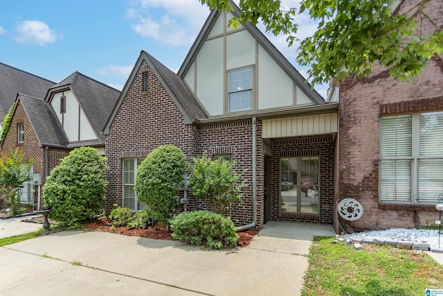 2449 Ridgemont Dr, Birmingham, AL 35244 - tudor-style house with brick siding, stucco siding, and a shingled roof