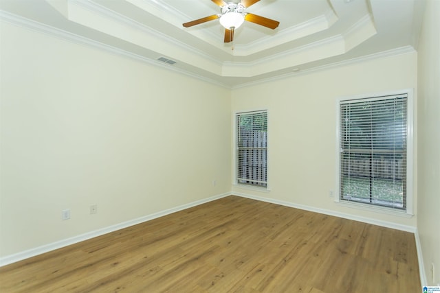 2449 Ridgemont Dr, Birmingham, AL 35244 - unfurnished room featuring crown molding, a raised ceiling, light wood-type flooring, ceiling fan, and baseboards