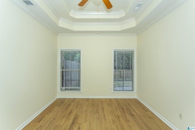 2449 Ridgemont Dr, Birmingham, AL 35244 - unfurnished room with a raised ceiling, light wood-style flooring, ornamental molding, a ceiling fan, and baseboards