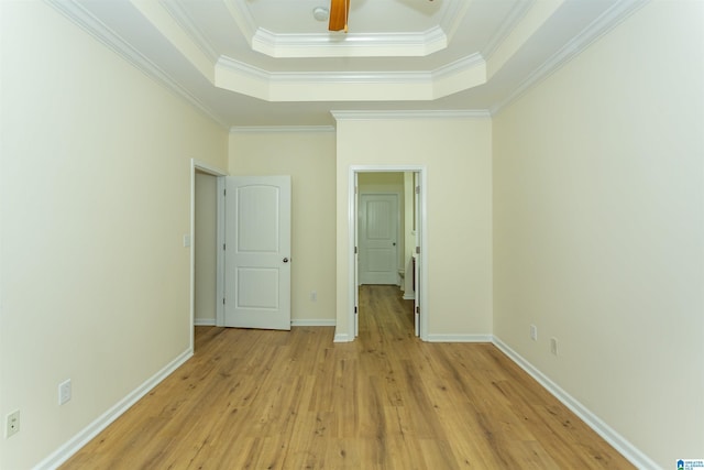 2449 Ridgemont Dr, Birmingham, AL 35244 - unfurnished bedroom with a tray ceiling, light wood-style flooring, baseboards, and crown molding