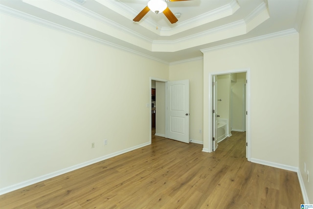 2449 Ridgemont Dr, Birmingham, AL 35244 - unfurnished bedroom with crown molding, a tray ceiling, light wood-style floors, baseboards, and ceiling fan