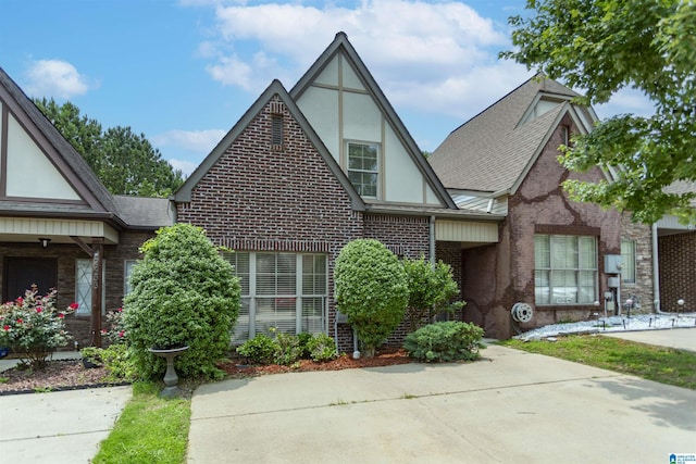 2449 Ridgemont Dr, Birmingham, AL 35244 - tudor-style house with brick siding, stucco siding, and a shingled roof