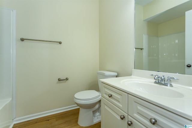 2449 Ridgemont Dr, Birmingham, AL 35244 - bathroom featuring vanity, toilet, wood finished floors, baseboards, and a shower