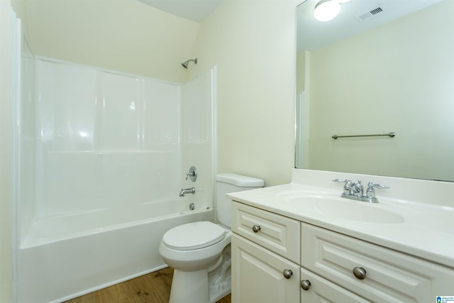 2449 Ridgemont Dr, Birmingham, AL 35244 - bathroom featuring vanity, toilet, wood finished floors, and shower / bathtub combination