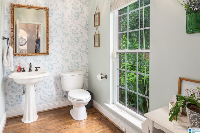7805 Rock Creek Cir, Bessemer, AL 35023 - bathroom with wallpapered walls and wood finished floors