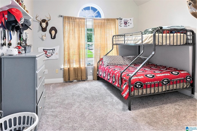 7805 Rock Creek Cir, Bessemer, AL 35023 - carpeted bedroom featuring baseboards and vaulted ceiling
