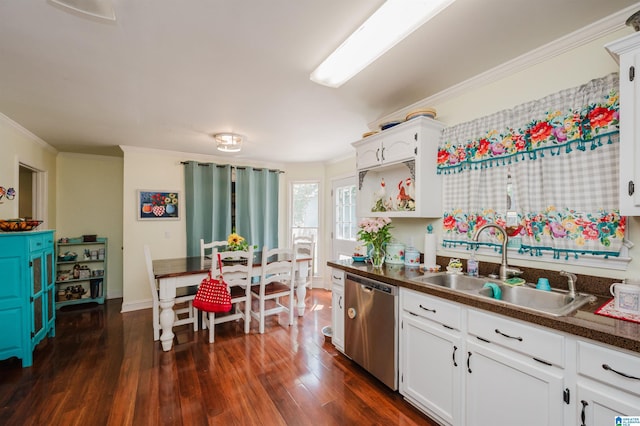 1121 Colonial Dr, Alabaster, AL 35007 - kitchen with stainless steel dishwasher, ornamental molding, a sink, dark countertops, and dark wood finished floors