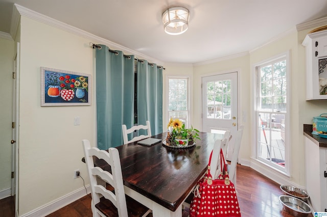 1121 Colonial Dr, Alabaster, AL 35007 - dining area featuring dark wood finished floors, crown molding, and baseboards