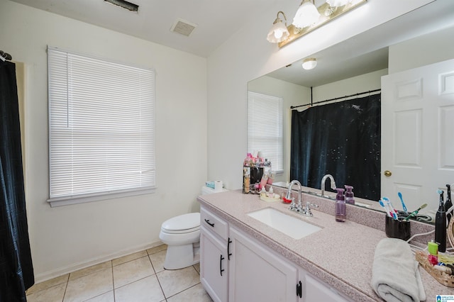 1121 Colonial Dr, Alabaster, AL 35007 - full bathroom with tile patterned floors, vanity, toilet, baseboards, and a shower with curtain