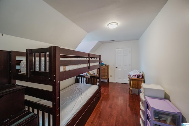 1121 Colonial Dr, Alabaster, AL 35007 - bedroom with wood finished floors, vaulted ceiling, and baseboards